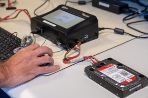Team members are able to extract data from data carriers . In this case, it’s the hard drive of a computer, but it could also involve telephones, tablets, memory devices, etc. Photo credit: FIOD